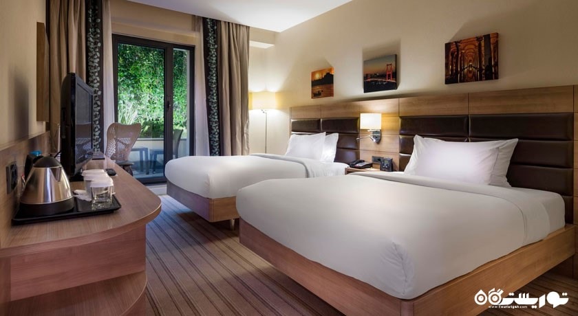 نمایی از تخت های اتاق توئین