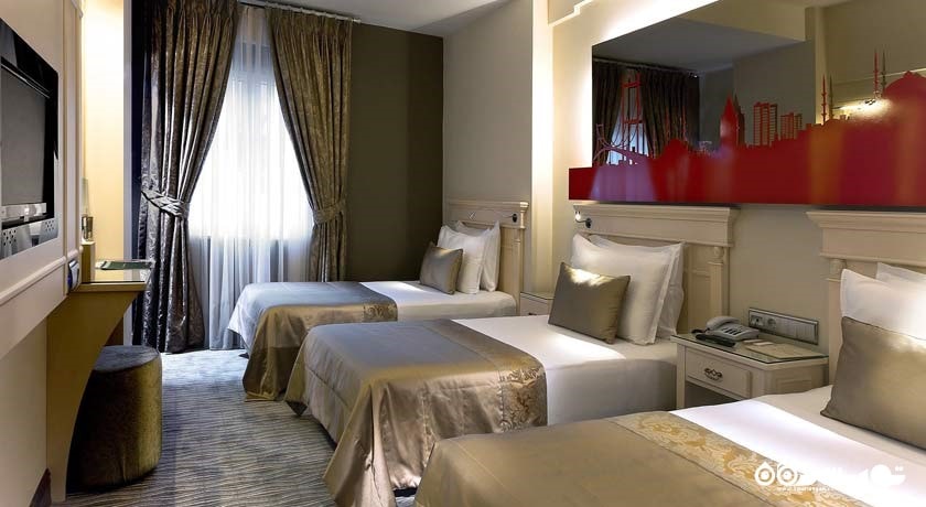 نمایی از تخت های اتاق تریپل