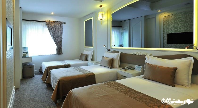 نمایی از تخت های اتاق تریپل	